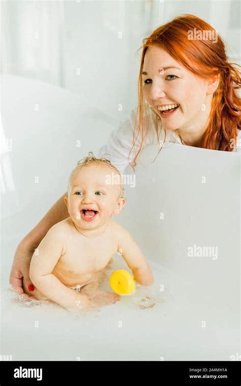 Mother With Baby In Bath Stock Photo Alamy