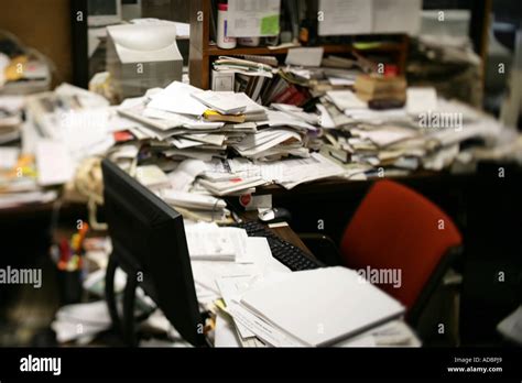 A Messy Desk With Lots Of Paperwork Stock Photo Alamy