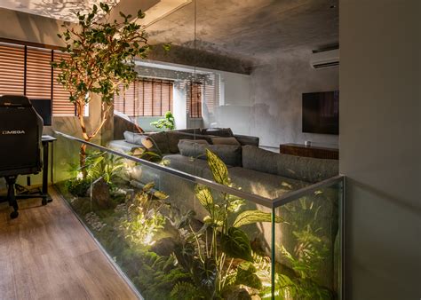 This Hdb Executive Apartment Has An Indoor Garden With A Tree In The