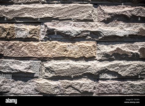 This Unique Photo Shows An Uneven Stone Wall On A Sunny Day This Photo