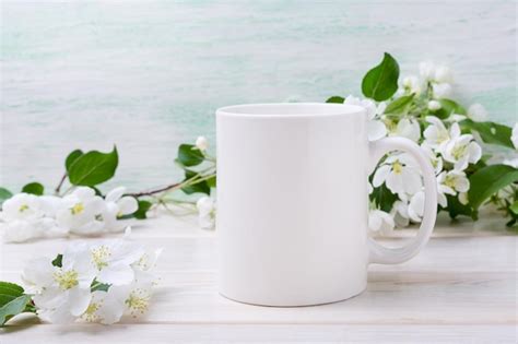 Premium Photo White Coffee Mug Mockup With Tender Apple Blossom