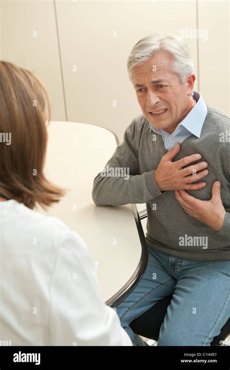 Woman Doctor Chest Pains Hi Res Stock Photography And Images Alamy