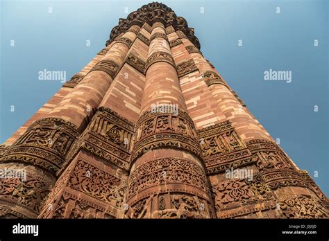 Qutub Minar Close Up With Red Sandstone Carvings On The Pillar Walls