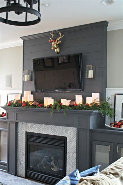 Laden with boughs, lights and even lemons, these decorated fireplace mantels show a festive christmas spirit and a creative approach. Sweater Wrapped Christmas Mantel from Thrifty Decor Chick