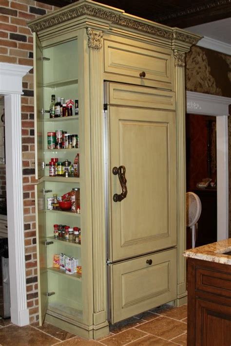 The meaning, quite visual, is walking into someone's house and banging all the pots and pans and making such a huge racket that it startles and disturbs the homeowner to distraction. Hidden cabinet on the side of refrigerator for spices, etc. By B L Cabinet | Hidden cabinet ...