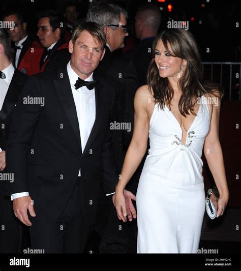 Elizabeth Hurley And Shane Warne Attending David Furnishs 50th