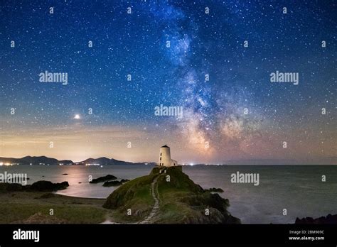 The Milky Way And Night Sky Over Twr Mawr Lighthouse Llanddwyn Island