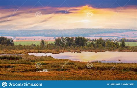 Picturesque Autumn Landscape With River And Trees During Sunset Stock