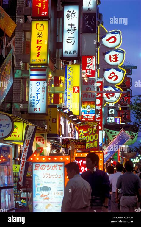 Neon Signs In Famous Dotonbori District Of Osaka Light Up The Night And