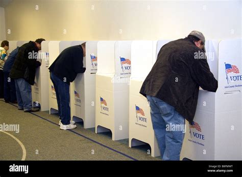 Voting in cardboard voting booths at a polling station in 
