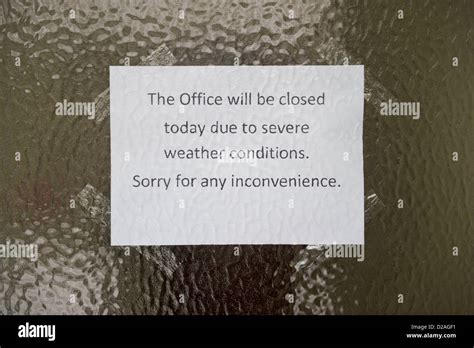 Sign On Front Door Of Office Closed Due To Severe Snow