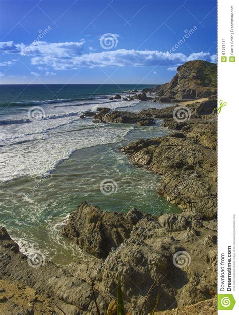 Pacific Coast Surf Beach And Rocks In Mexico Stock Photo