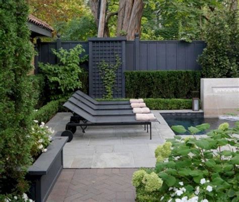 A small wall or fence painted in this happy shade brings instant zing to a garden. Pin by Andrew Galloway on Houz | Black garden fence ...