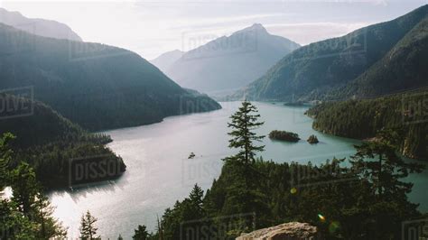 Turquoise Lake Below Mountains Stock Photo Dissolve