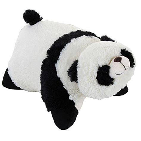 A Black And White Stuffed Panda Bear Laying On Its Back With Its Eyes