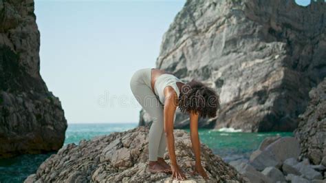 Girl Practicing Yoga Pose On Ursa Beach African Woman Bending Body To