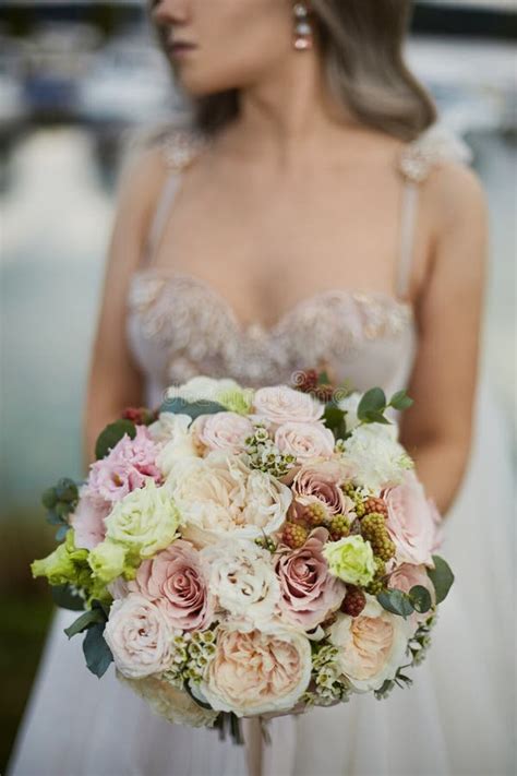 Beautiful Bride In A Luxurious Wedding Dress With A Bridal Bouquet
