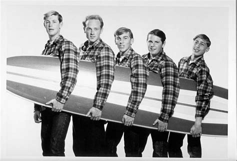 Rock And Roll Band The Beach Boys Pose For A Portrait With A