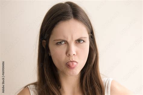 Headshot Portrait Of Offended Young Woman Angry Teen Girl With Grumpy