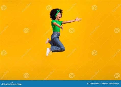Full Length Profile Photo Of Astonished Girl Jump Raise Arms Catch