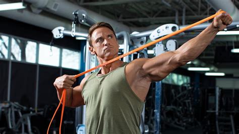 Hold the resistance band next to your shoulders in a secure and locked position. Resistance Band Shoulder Workout | Bodybuilding.com