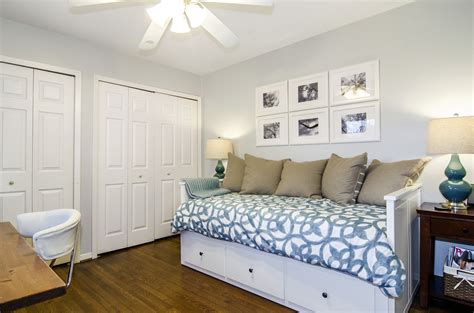 Dark grey walls, big white crown molding and baseboards, bamboo floors. Office/ guest room combo, great idea for that old twin bed ...