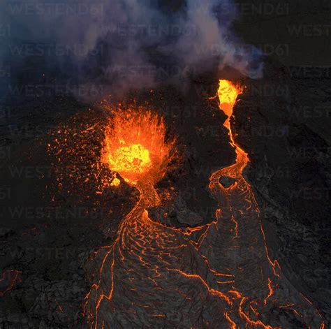 From Above Magma Sparks Out Of The Volcano Hole And Run Like Rivers Of