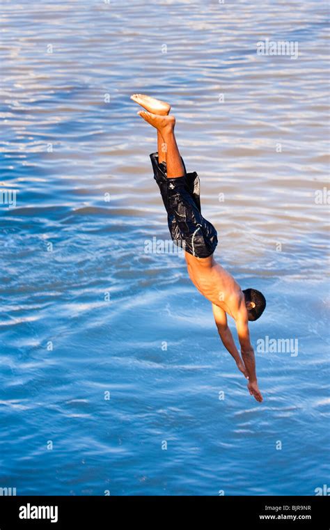 This Is An Image Of A Young Man Diving Into The Water Stock Photo Alamy