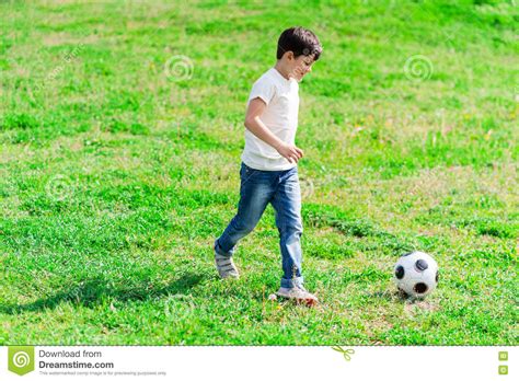 Pretty Male Kid Is Playing With Ball Stock Photo Image Of Nature
