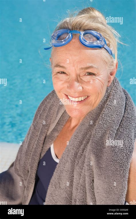 Mature Woman By Swimming Pool Stock Photo Alamy