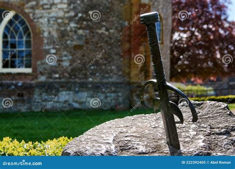 Sword Stuck In A Stone In A Park Next To A Church Stock Image Image