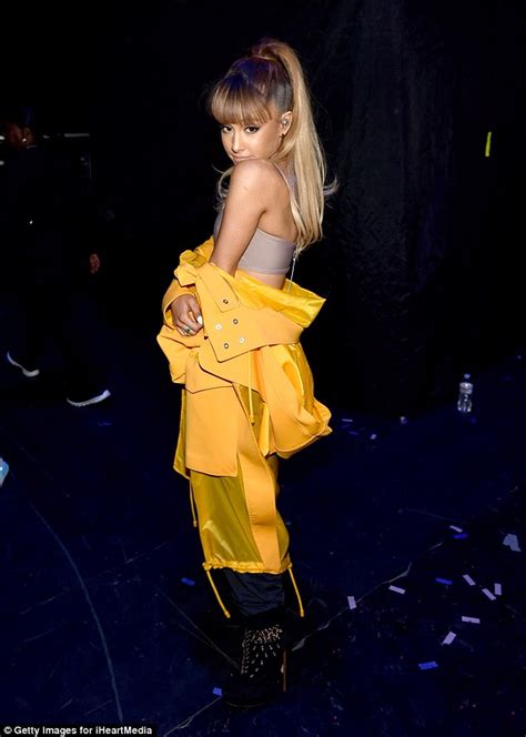 Katching My I Ariana Grande Dazzles On Stage In Fiery Yellow Coat