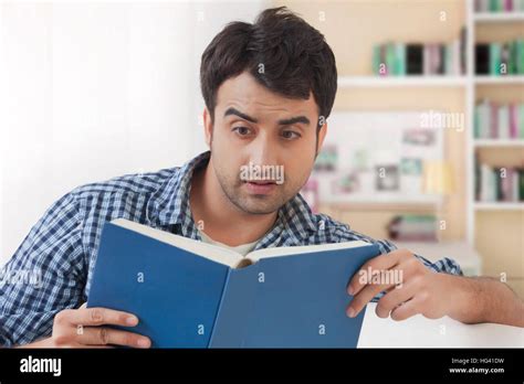 Young Man Reading Book Stock Photo Alamy