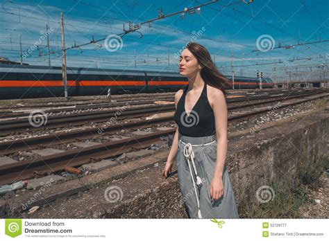 beautiful brunette posing in an industrial context stock image image of cute beautiful 52729777