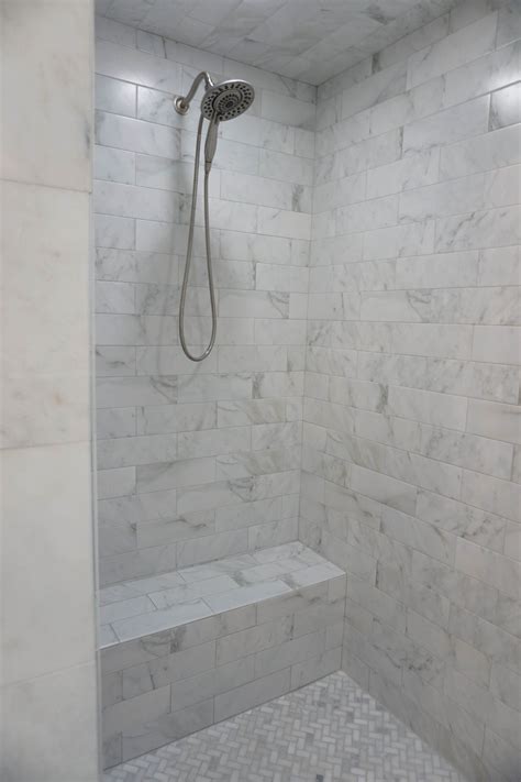 Custom Tiled Shower With Double Shower Heads And Built In Seat
