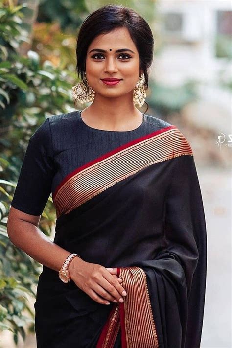In A Elegant Black Color Saree And High Neck Elbow Length Sleeve Blouse Design In 2020 Fancy