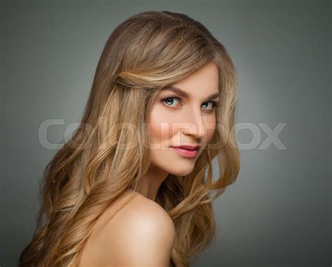 cute blonde woman with long healthy hair and clear skin portrait stock image colourbox