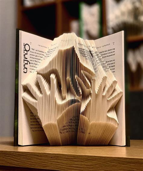 Artist Creates Different Art Pieces From Folded Books Mobispirit