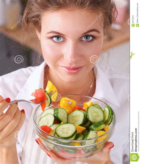 Young Woman Eating Fresh Salad In Modern Kitchen Stock Image Image Of