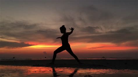 Silhouette Of Beautiful Yoga Woman In The Blue Sky Morning