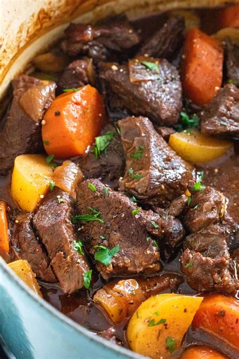 Beef Stew With Carrots And Potatoes In A Blue Pot