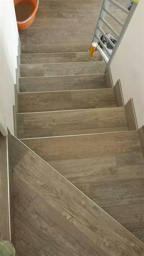 Building ceramic tile stairs isn't much different than laying down a ceramic tile floor. Wood look tiles - stairs | Laminate stairs