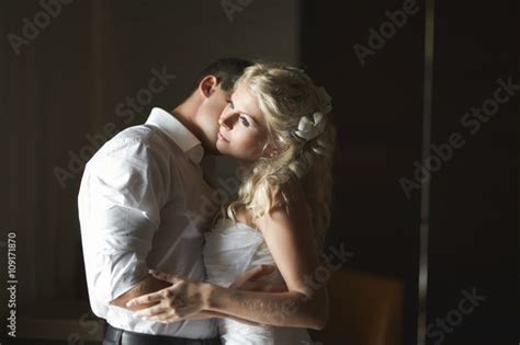 Beautiful Young Couple Kissing With Emotional Embrace Buy This Stock