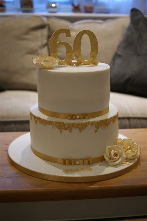 This colorful buttercream cake design with easy chocolate candy coating accents is so cheerful and perfect for birthdays! Gold Leaf 60th Birthday Cake - Bakealous