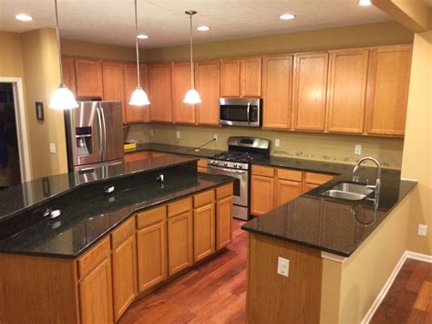 Granite colors that will match with oak cabinets perfectly : Uba Tuba Granite Countertops (Pictures, Cost, Pros & Cons)