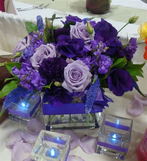 Purple And Lavender Arrangement In This Square Vase Purple