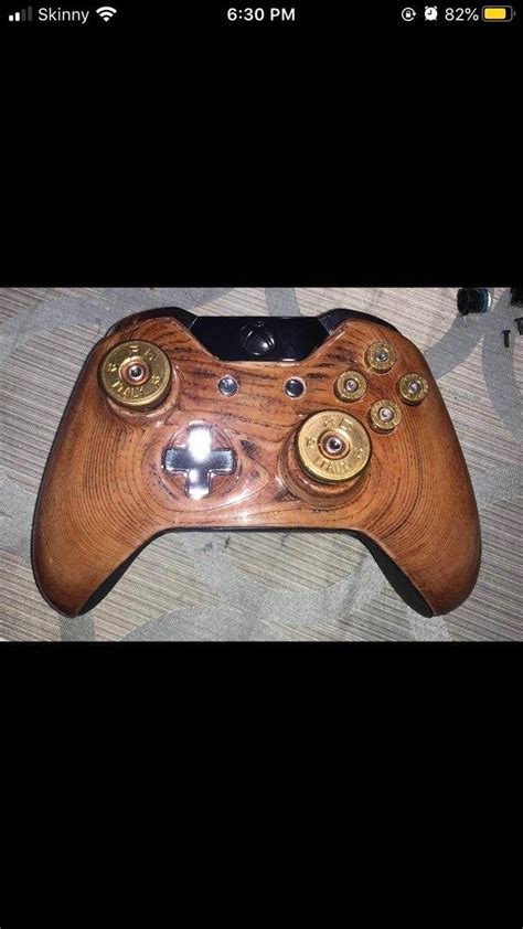 A Wooden Case For An Xbox One Controller With Brass Bullet Buttons And