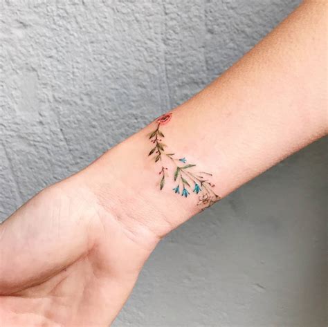 Flower Bracelet Tattoo On The Right Wrist