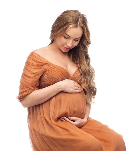 Happy Pregnant Woman Touching Her Big Belly Over White Background Stock