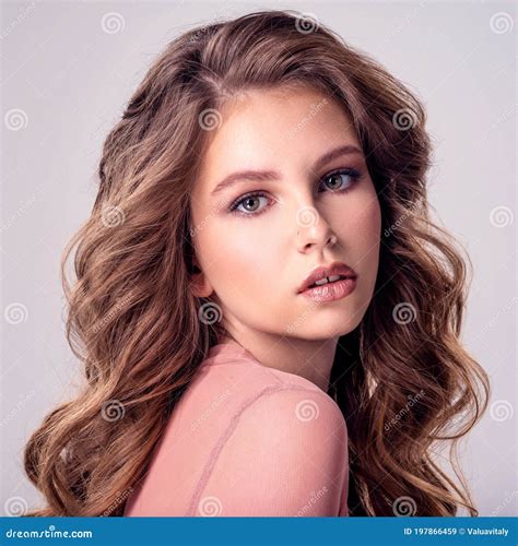 Beautiful Brown Hair Girl With Long Wavy Hair Young Girl Posing In